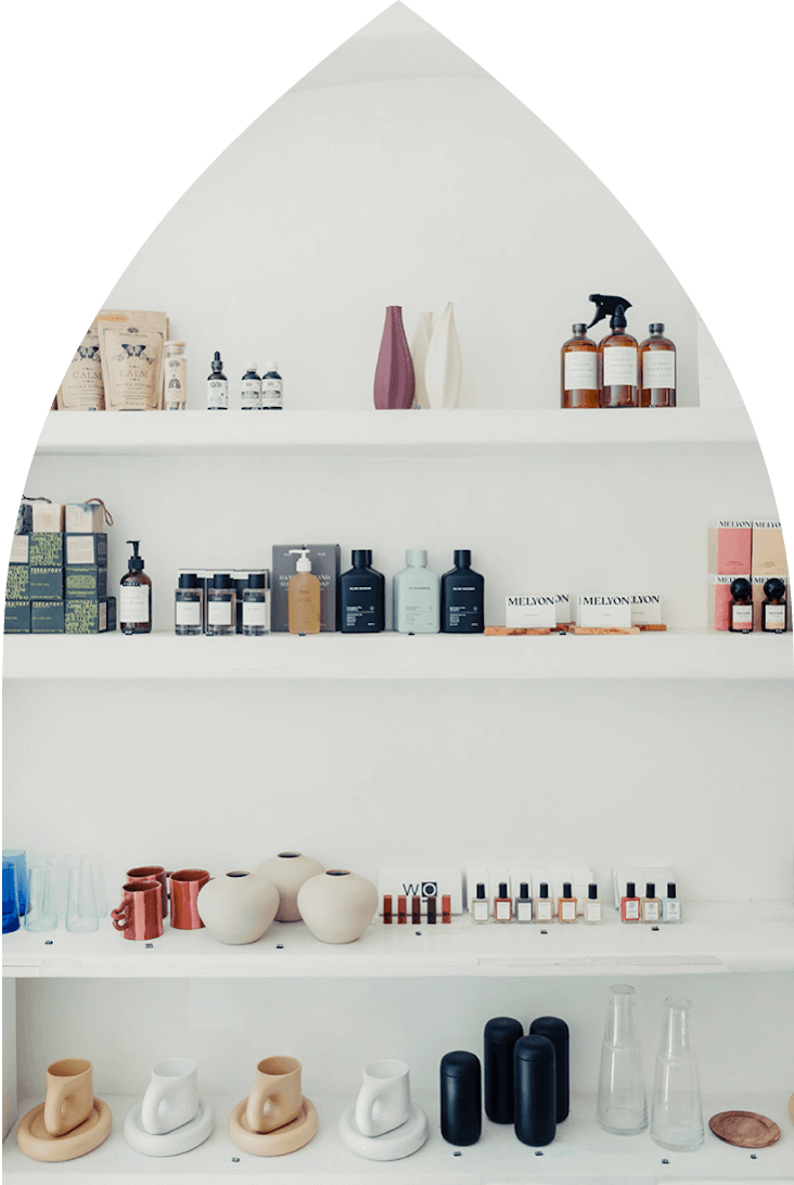 White shelf in a neighborhood store with stylishly arranged goods in Alagöz Emlak İnşaat near 463W142 NYC Condo.