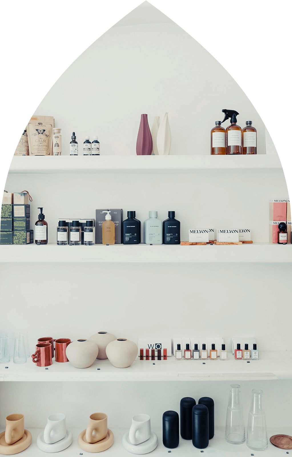 White shelf in a neighborhood store with stylishly arranged goods in Alagöz Emlak İnşaat near 463W142 NYC Condo.