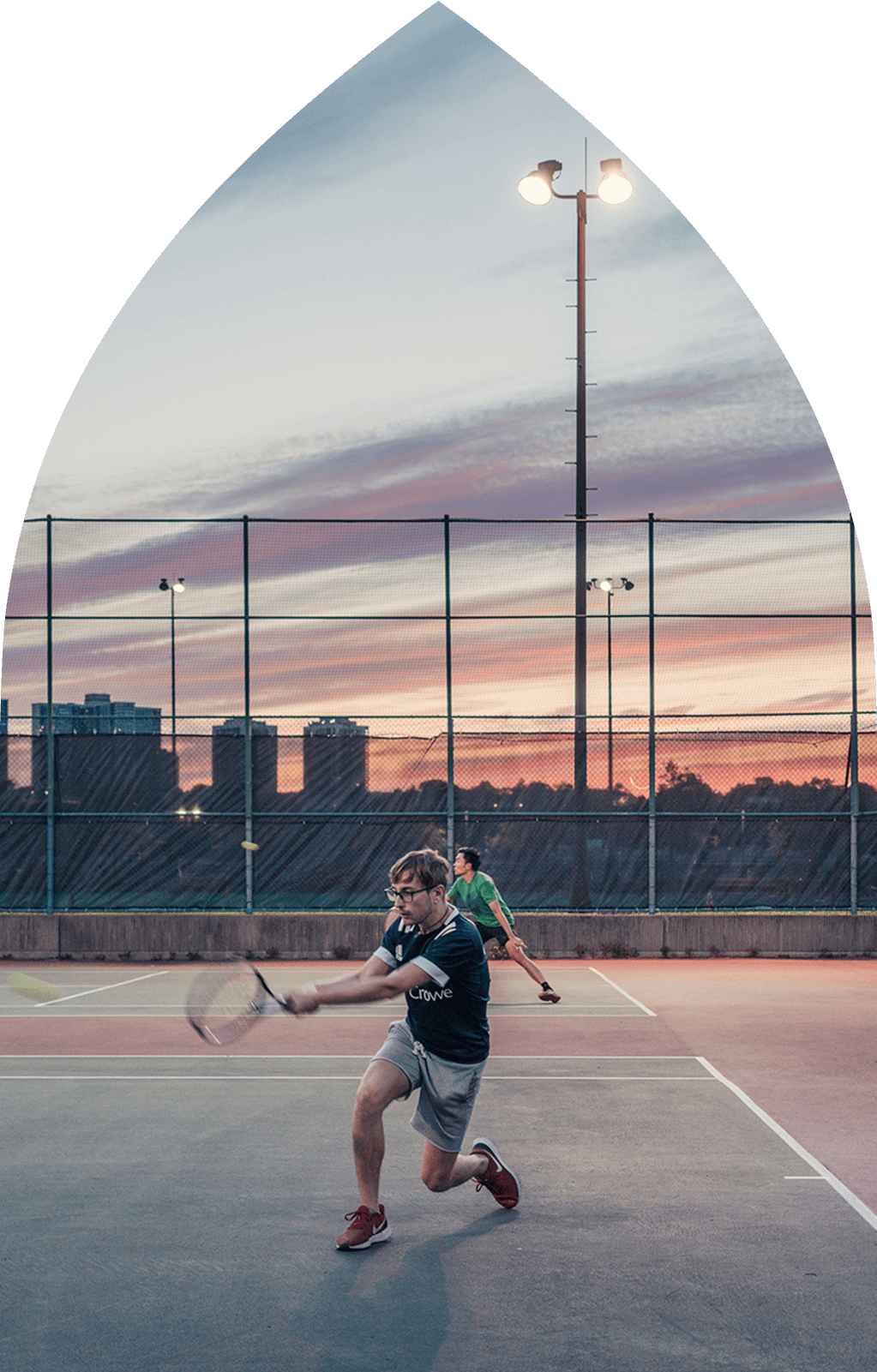 Man playing tennis at tennis court in Harlem NYC near Alagöz Emlak İnşaat condo at 463w142.